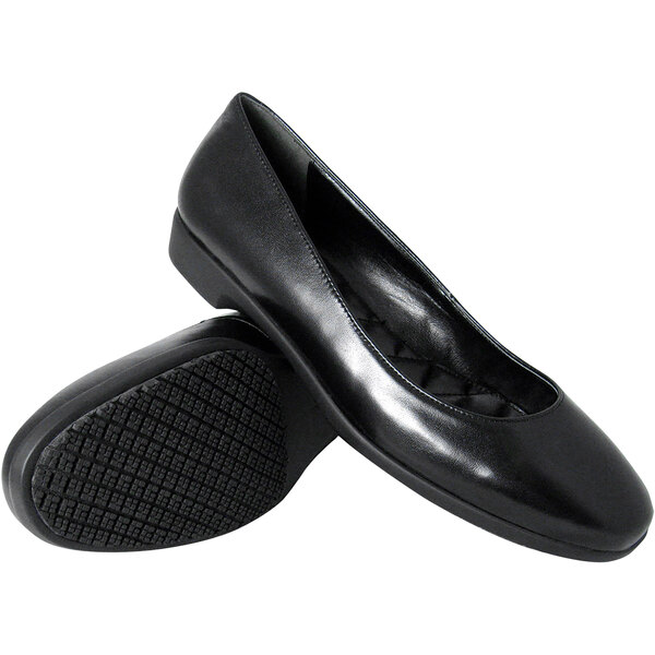 A pair of black Genuine Grip water-resistant dress shoes with a rubber sole.