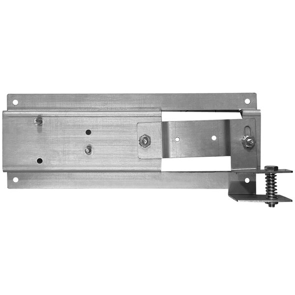 A metal plate with screws for a stainless steel door latch.