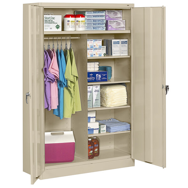 A Tennsco sand jumbo combination cabinet with solid doors filled with items on the shelves.
