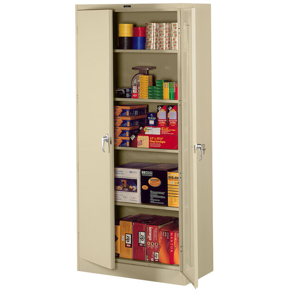 A Tennsco sand metal storage cabinet with shelves and solid doors.