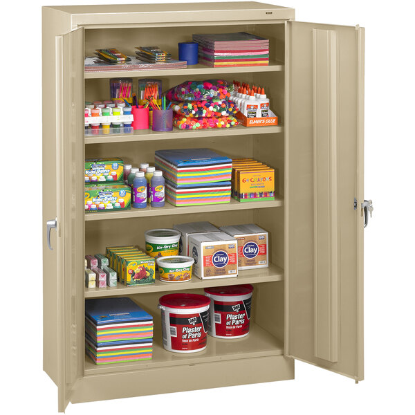 A Tennsco sand metal storage cabinet with shelves full of items.