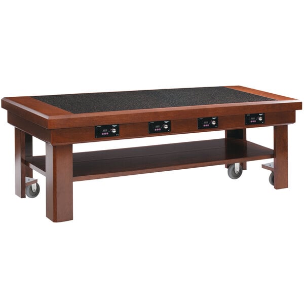 A dark cherry wooden Vollrath induction buffet table on wheels.