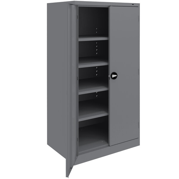 A dark gray steel Tennsco storage cabinet with shelves.