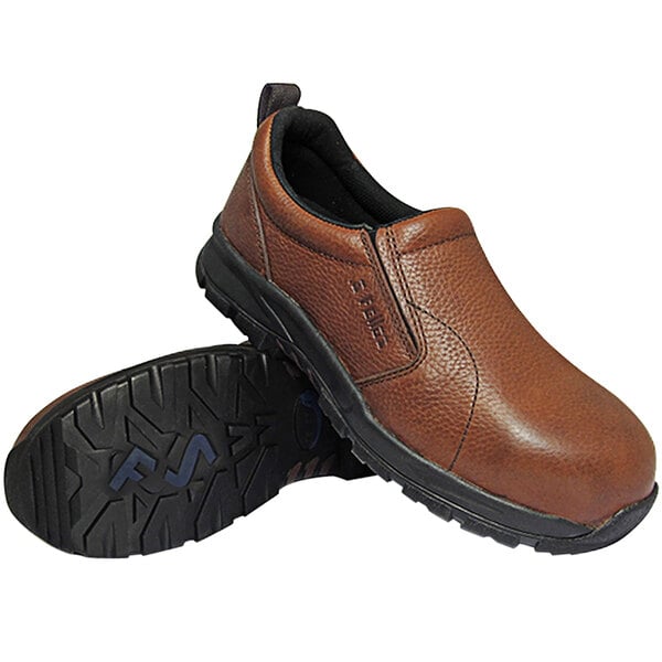 A pair of Genuine Grip brown work shoes with a non-slip sole.