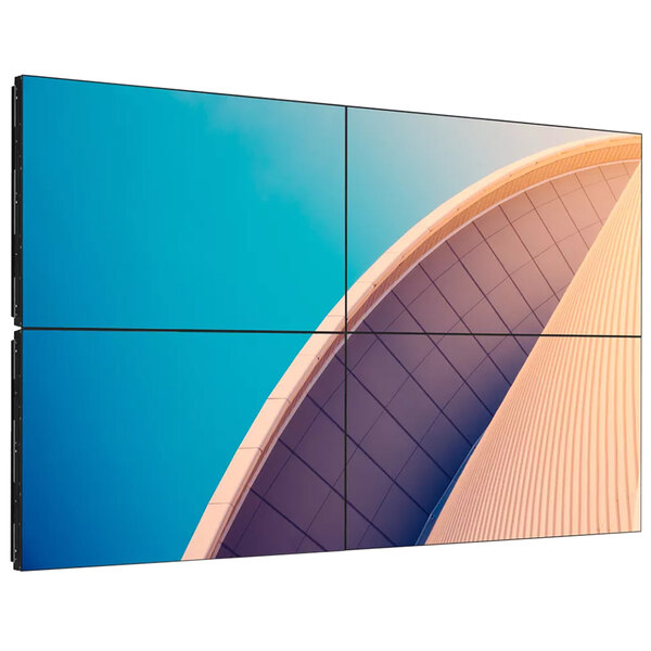 A Philips X-Line video wall display showing a building against a blue sky.