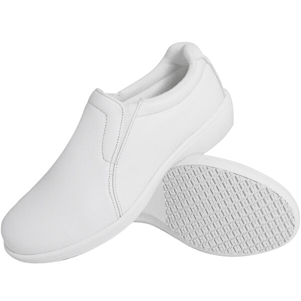 A pair of Genuine Grip white slip-on shoes.