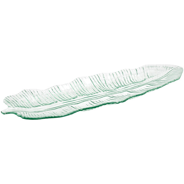 A clear glass leaf platter with a curved edge.