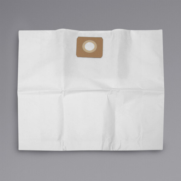 A brown and white circular Powr-Flite vacuum cleaner bag with a hole in it.