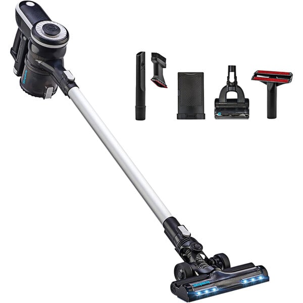 A Simplicity S65D cordless multi-use stick vacuum with various accessories and tools.