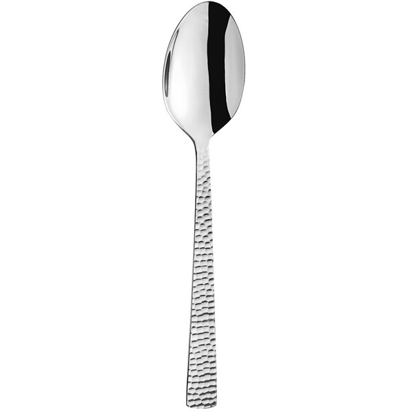 An Amefa Felicity stainless steel serving spoon with a textured handle.