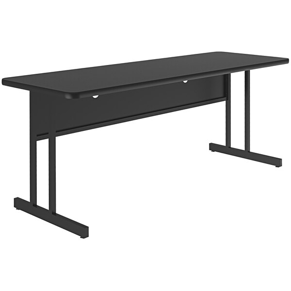 A black rectangular Correll desk with black legs and a black granite finish top.