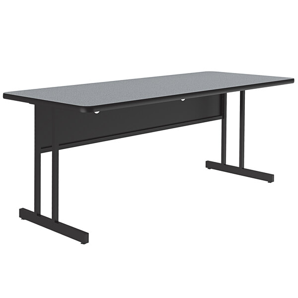 A black rectangular desk with a gray granite finish top and black legs.