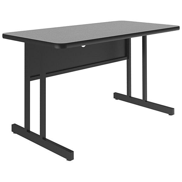 A grey rectangular Correll desk with black legs.