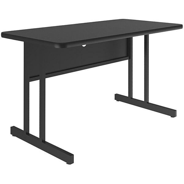 A Correll rectangular desk with black granite finish top and black legs.