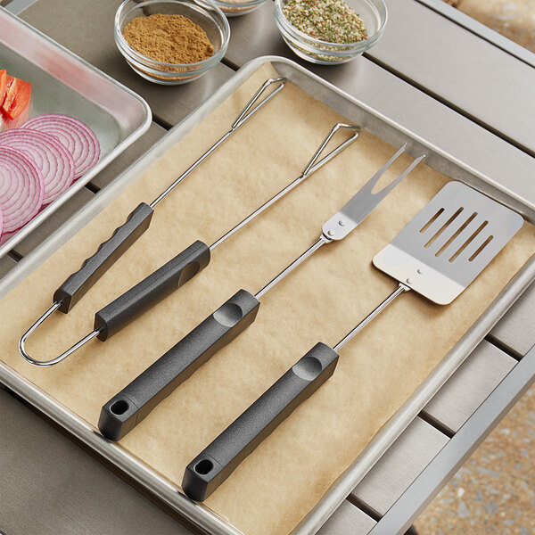 A tray with Mr. Bar-B-Q barbecue utensils on it.