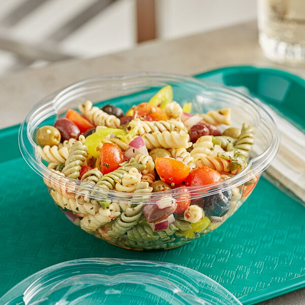A World Centric clear compostable deli bowl filled with pasta salad on a table.