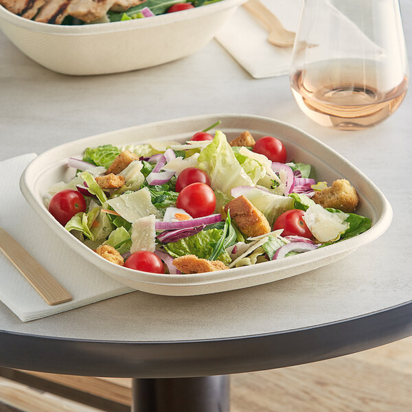 A salad in a World Centric compostable square fiber bowl.