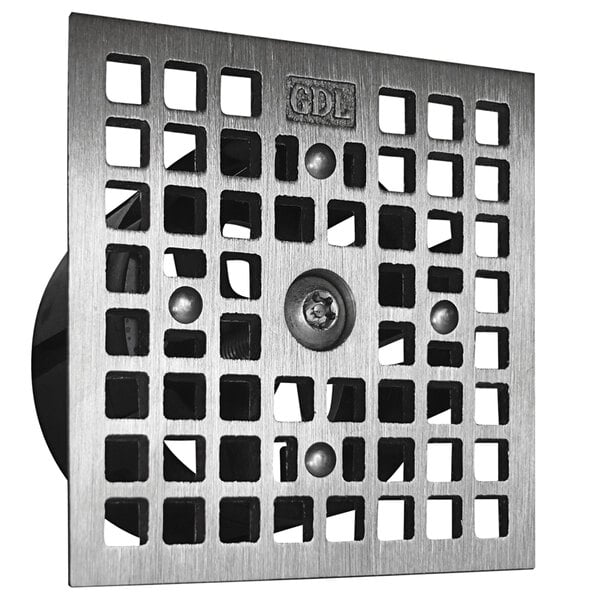 A metal square drain grate with holes.