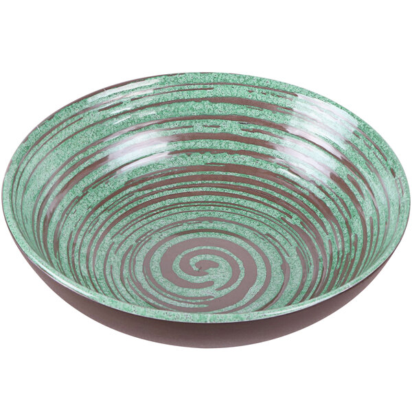 A green melamine bowl with a swirl pattern in green and brown.