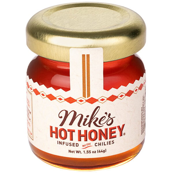 A case of Mike's Hot Honey mini jars on a table.