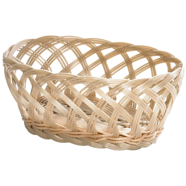 A Tablecraft beige natural open weave oval rattan bread basket.