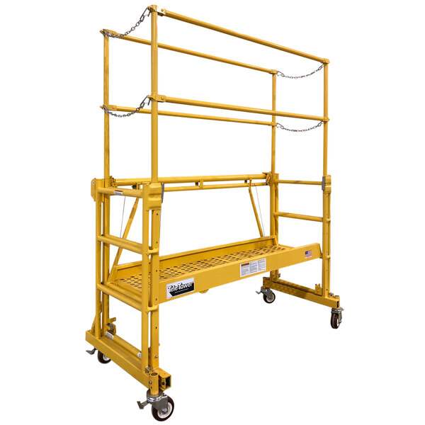 A yellow Paragon Pro Manufacturing Solutions Tele-Tower Compact Scaffold on wheels.