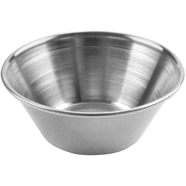 A silver stainless steel condiment cup.