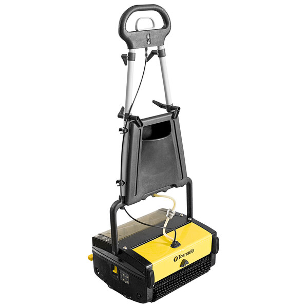 A black and yellow Tornado walk behind cylindrical floor scrubber with a white handle.