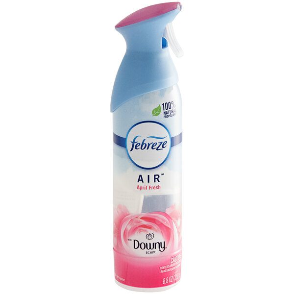 A bottle of Febreze Air Downy April Fresh scented air freshener with a pink spray lid.