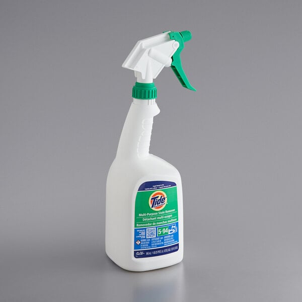 A white bottle of Tide Professional Multi-Purpose Stain Remover with a green handle.