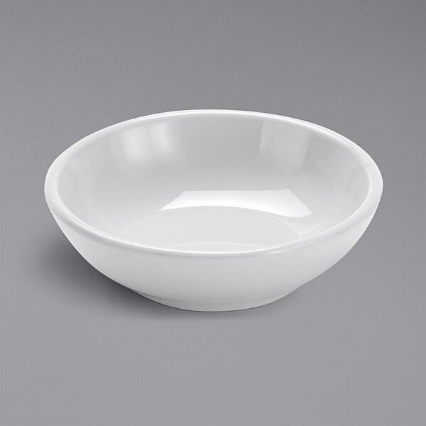 An American Metalcraft white mini melamine bowl on a gray surface.