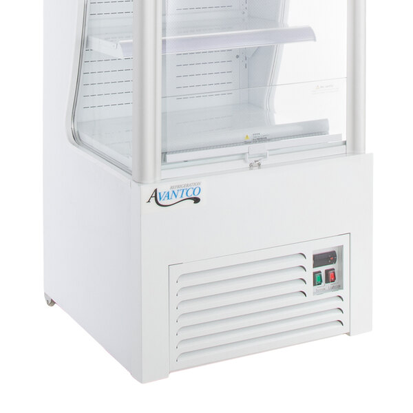 An Avantco white refrigerated air curtain merchandiser with a glass door.