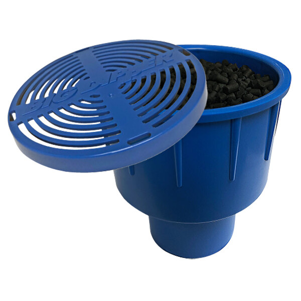 A blue container with a lid open filled with black granules.