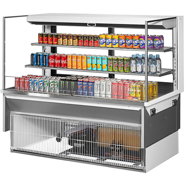 A Turbo Air white drop-in refrigerated display case with a variety of drinks on shelves.