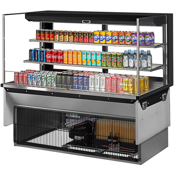 A Turbo Air drop-in refrigerated display case with soda cans and beverages on shelves.