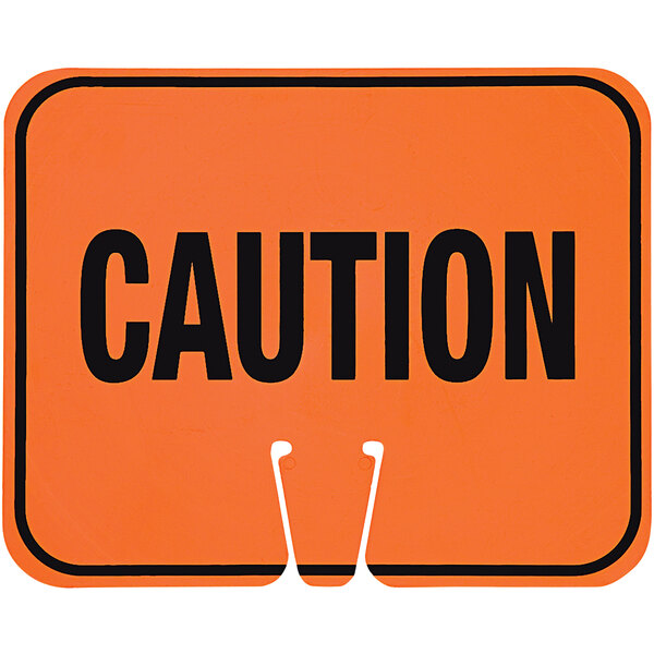 A close up of a Cortina orange "Caution" cone sign with black lettering.