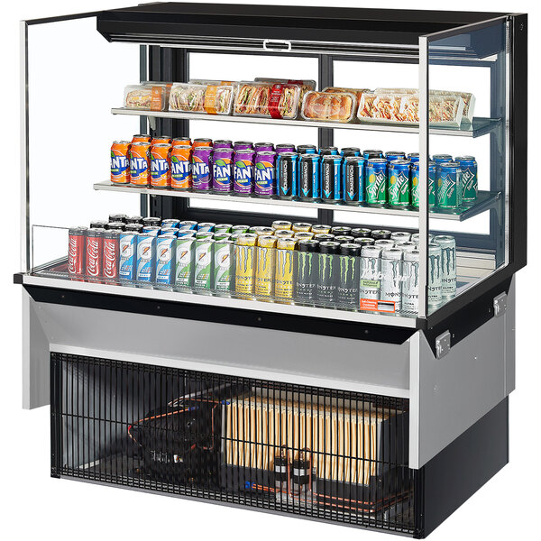 A Turbo Air drop-in refrigerated display case with drinks and cans inside.