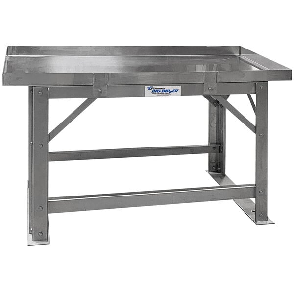 A stainless steel support frame kit for a Big Dipper grease trap on a metal table.