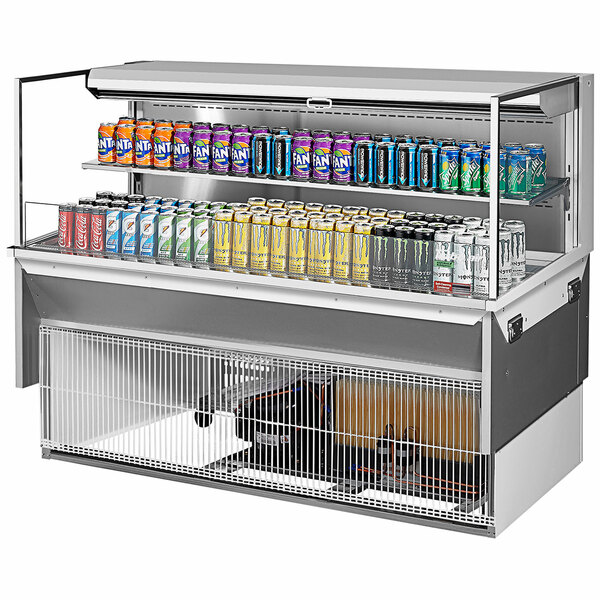 A white Turbo Air drop-in refrigerated display case with several cans of soda on a shelf.