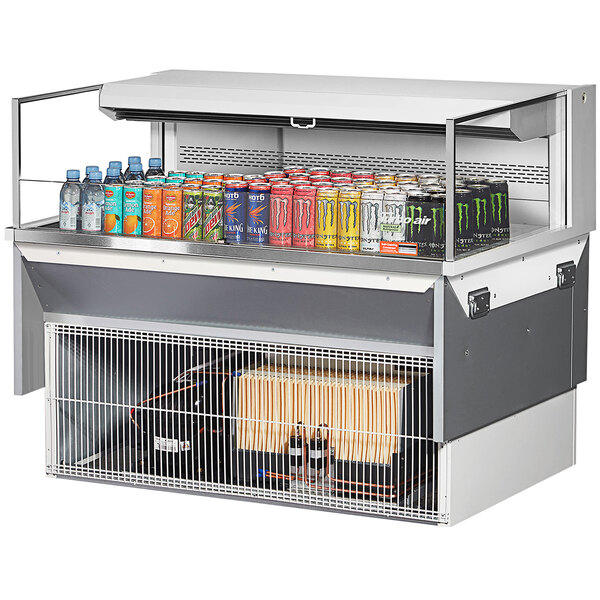 A Turbo Air white drop-in refrigerated display case with drinks inside.