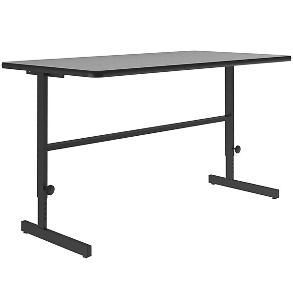 A gray rectangular table with a black metal frame.