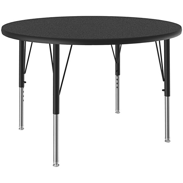 A round black Correll activity table with metal legs.