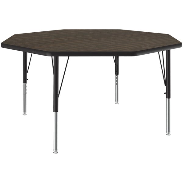 A walnut octagon activity table with metal legs.