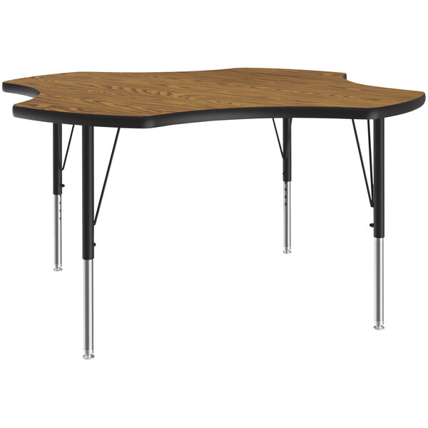 A Correll medium oak activity table with black legs and a curved top.