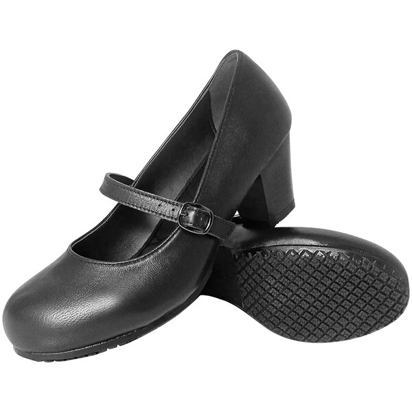 A pair of black Genuine Grip dress shoes for women with a close-up of the sole.