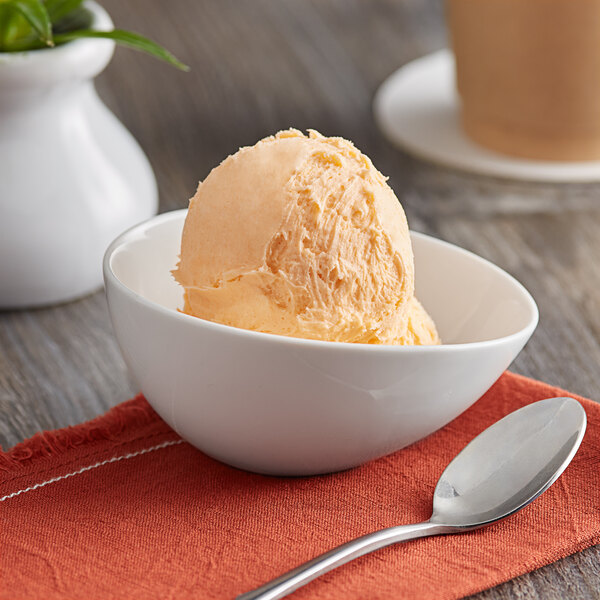 A bowl of Oringer Neutral Sherbet Base ice cream with a spoon.