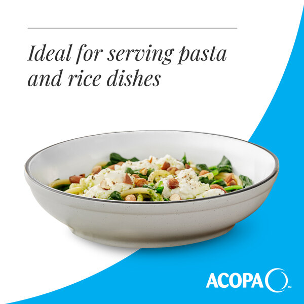 A gray matte stoneware pasta bowl filled with a pasta or rice dish.