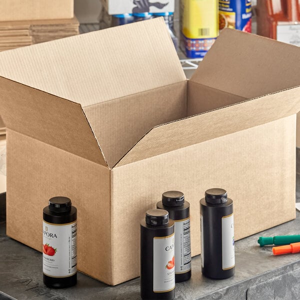 An open Lavex Kraft shipping box with several bottles of paint inside.
