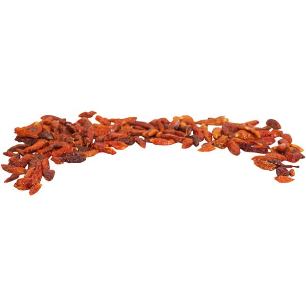 A pile of Fiery Farms Red African Bird's Eye dried whole pepper pods.