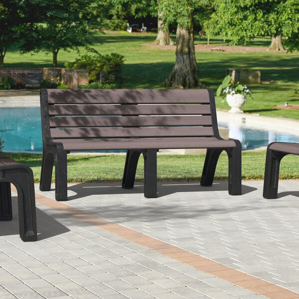 A group of MasonWays brown plastic benches with black legs on an outdoor patio.